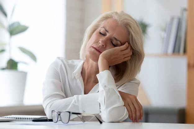 Exhausted senior businesswoman fall asleep at workplace Exhausted senior businesswoman fall asleep at workplace