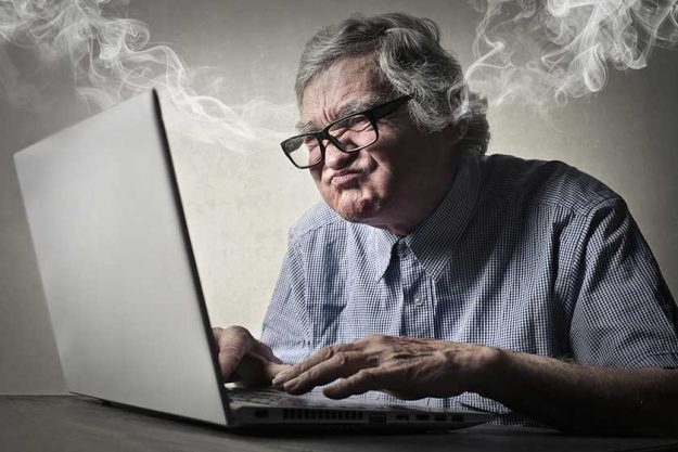 Angry businessman working at pc Angry businessman working at pc