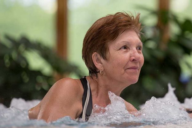 Elderly woman in jacuzzi Elderly woman in jacuzzi