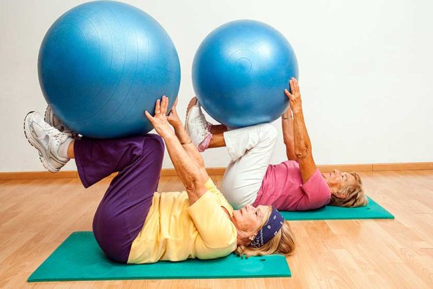 Senior women exercising with gym balls. Senior women exercising with gym balls.