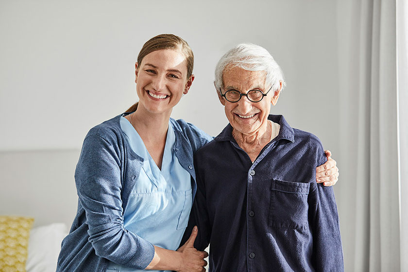 happy senior woman and caregiver Essential Mobility Safety Features To Consider For Senior Living Care