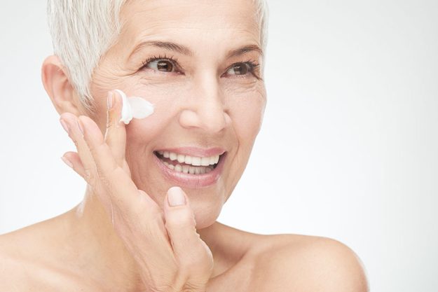 Beautiful Senior Woman Putting Cream Beautiful Senior Woman Putting Cream