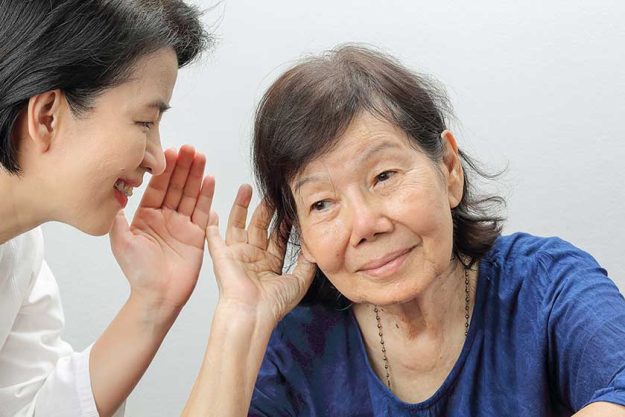 Asian seniors woman hearing loss , Hard of hearing