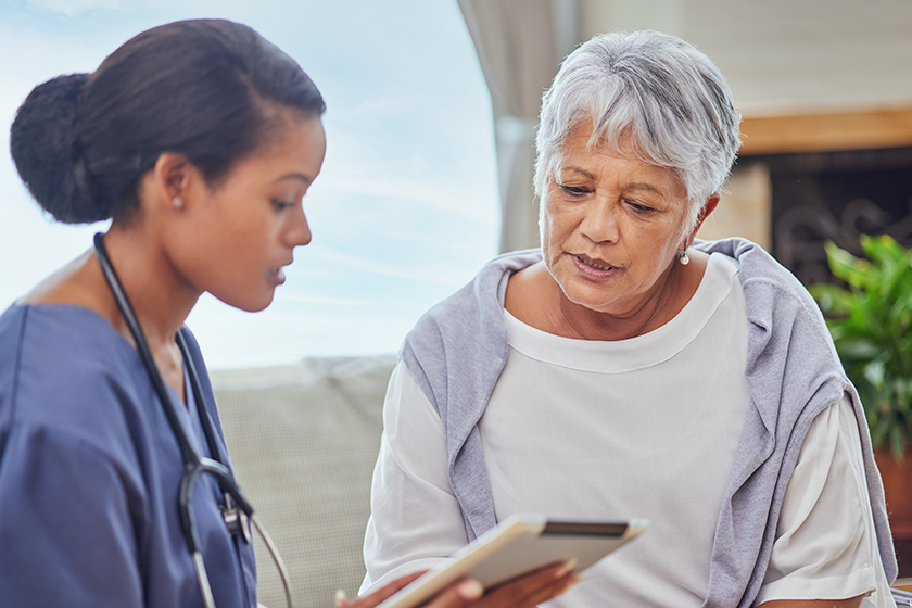 hispanic-senior-woman-cosy-sofa-her-female-nurse