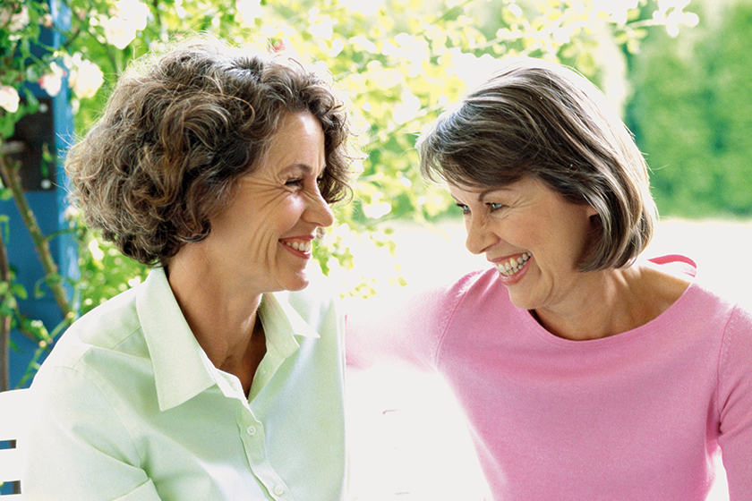 women-laughing-garden women-laughing-garden