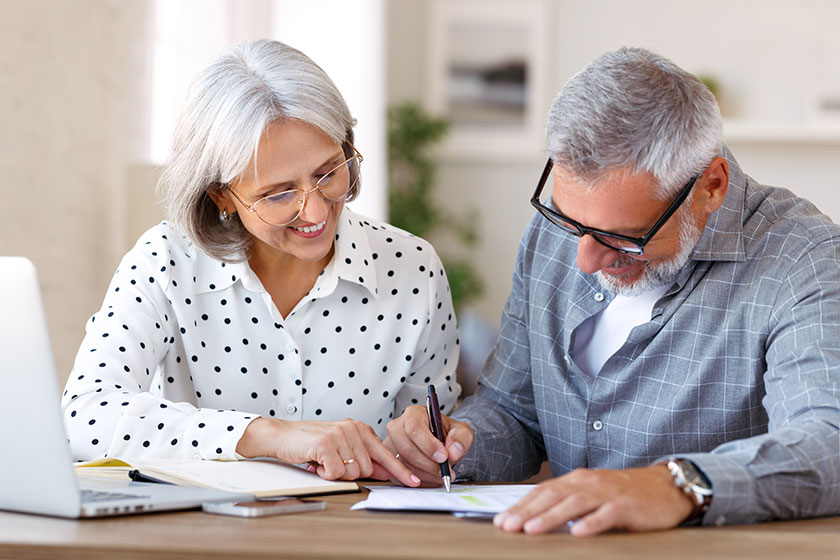 Senior happy family couple doing homework