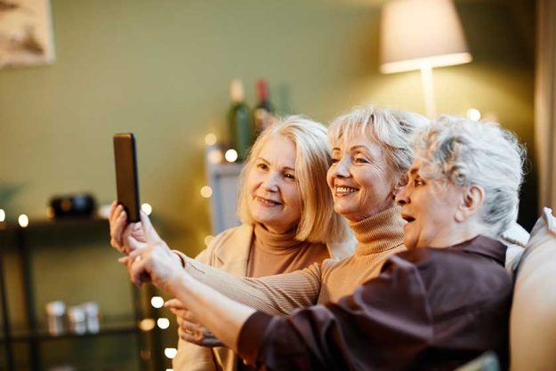 Three old female friends making selfie Three old female friends making selfie