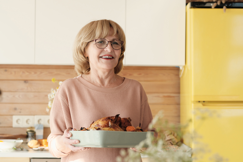 Woman cooking turkey Helping The Elderly Feel At Home In 55+ Apartments In PA