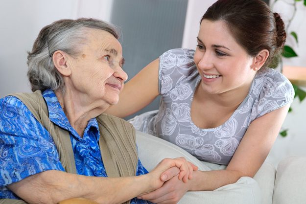 Senior woman with her home caregiver