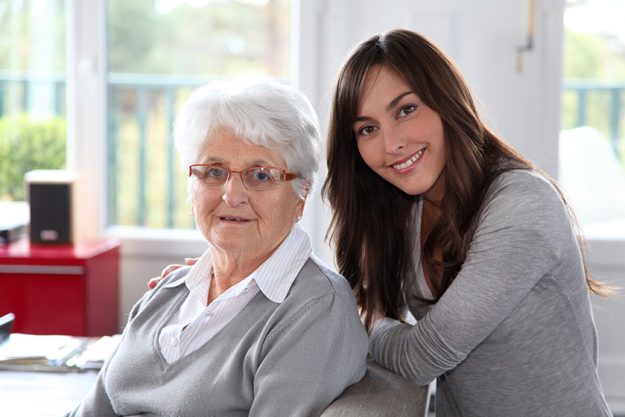 Closeup of elderly woman with young woman Closeup of elderly woman with young woman