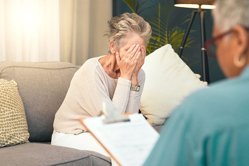 Crying, sad or old woman in counseling with a psychologist