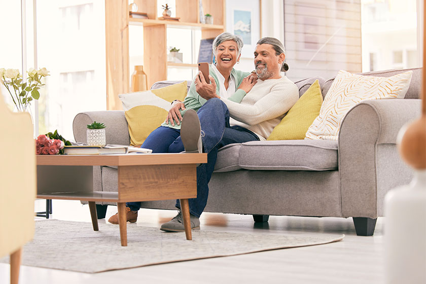 elfie, happy and mature couple on sofa with smile social Media profile elfie, happy and mature couple on sofa with smile social Media profile