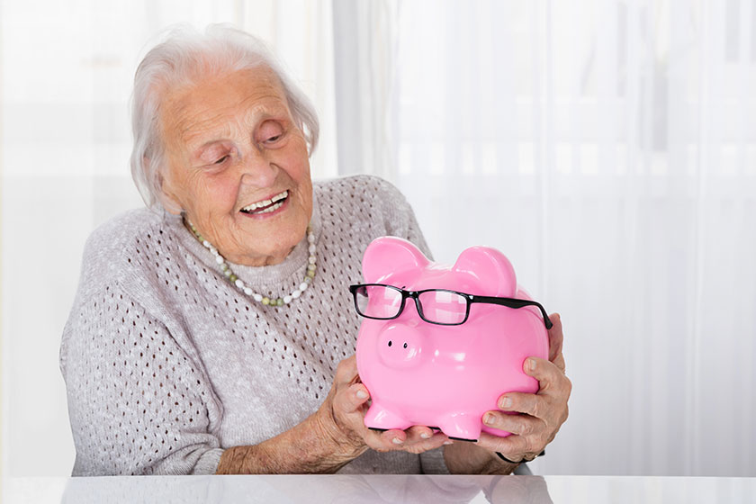 Senior Woman Holding Piggybank Senior Woman Holding Piggybank