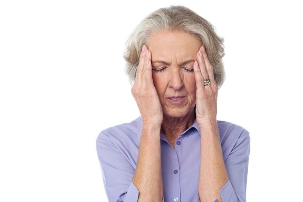 Old lady suffering from headache Old lady suffering from headache