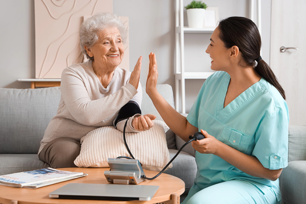 senior-woman-physical-therapist-measuring-blood-pressure senior-woman-physical-therapist-measuring-blood-pressure