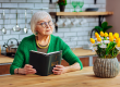 attractive-lady-in-years-holding-an-open-holy-bible