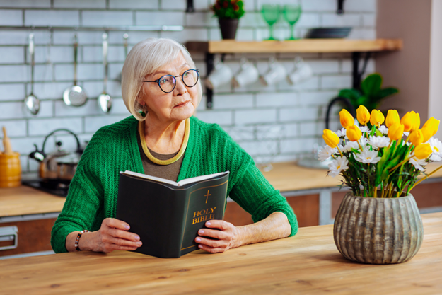 attractive-lady-in-years-holding-an-open-holy-bible
