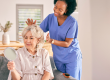 Nurse, senior woman and hair care by mirror