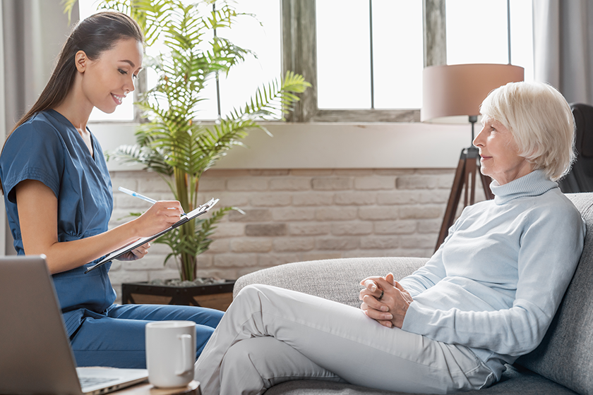 Caregiver guiding a senior through a calm routine at home