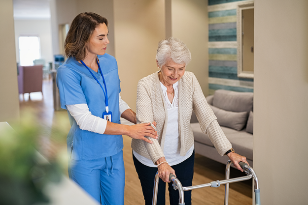 lovely-nurse-helping-old-woman-walk-nursing-home-walker Lovely nurse helping old woman to walk