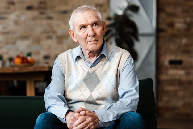 sad-elderly-man-sitting-sofa Sad elderly man sitting on sofa during self isolation