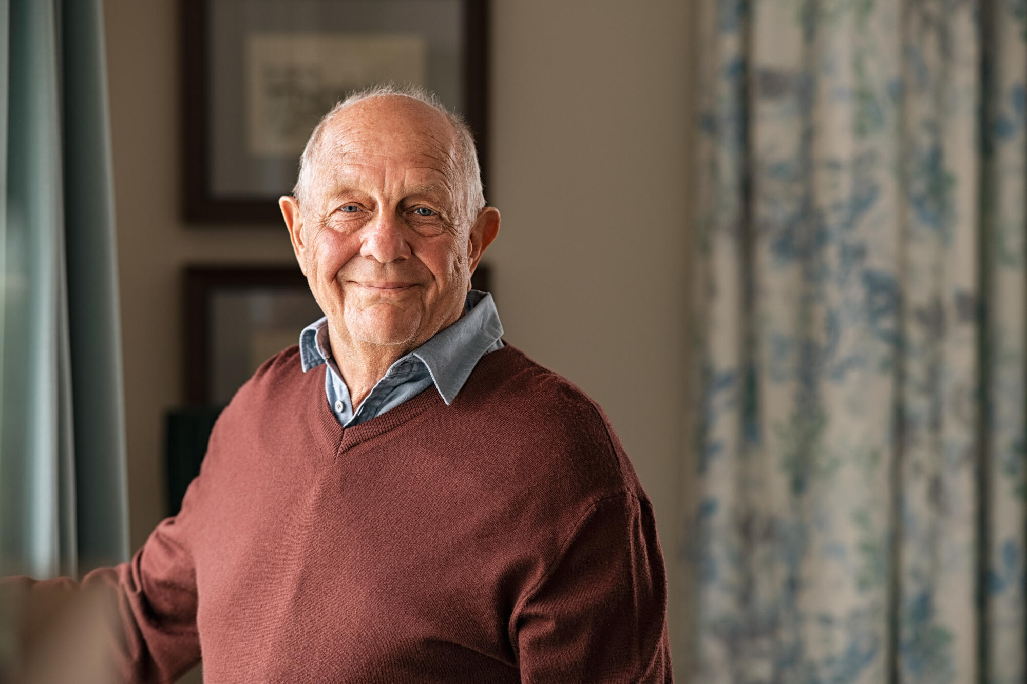 Portrait,Of,Happy,Retired,Senior,Man,Standing,At,Home,Near